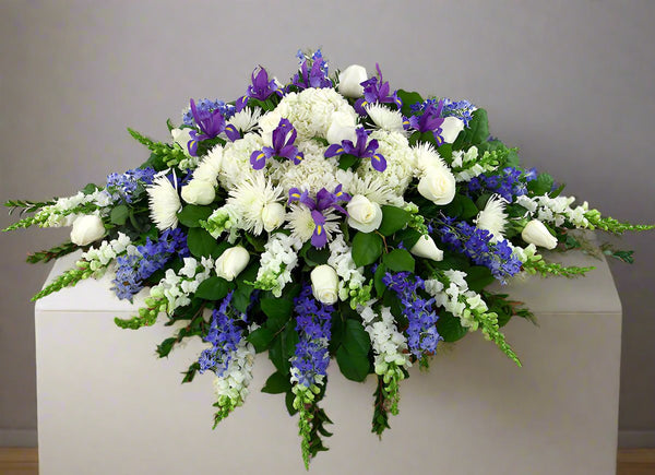 Blue Skies | White and Blue Casket Spray | Sunstrum's Florist