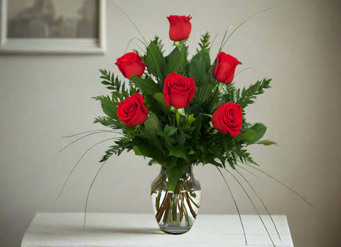 6 red roses in a vase